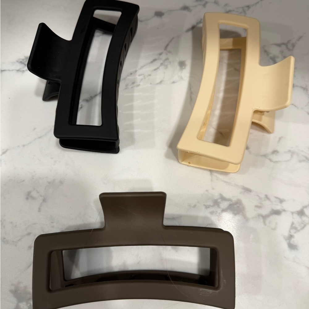 Three jumbo size claw hair clips tan black and brown